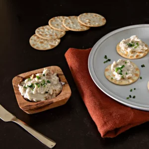 Smoked bluefish pate in a bowl with crackers