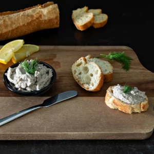 Smoked pollock pate on baguette and cutting board