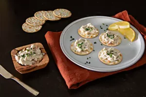 Smoked pate on crackers and in a bowl for navigation